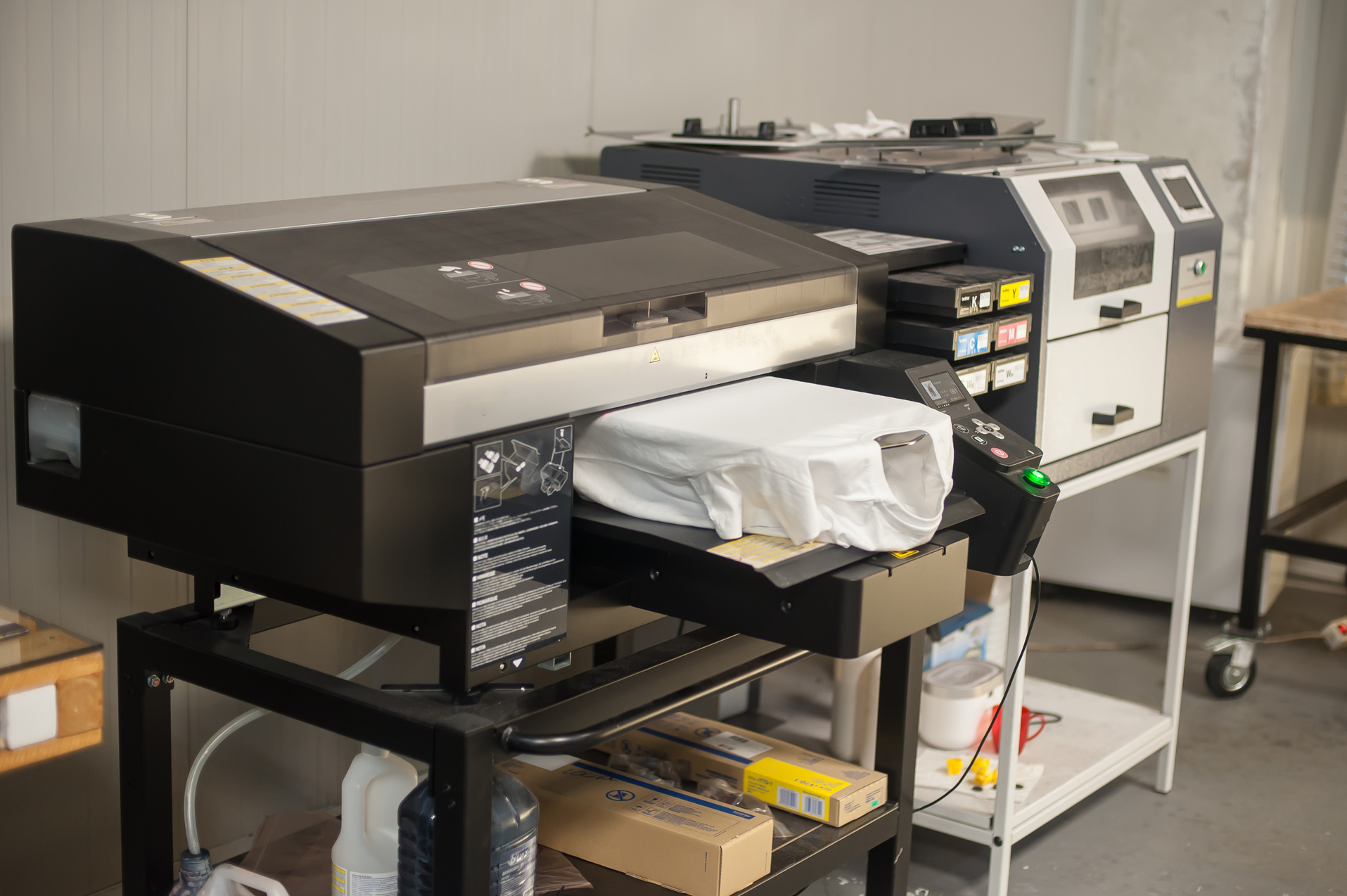Digital t-shirt printing heat press machine in printing production shop